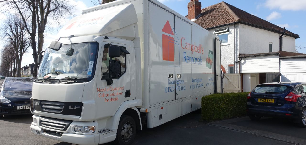 Bromsgrove Removals firm Campbell's lorry backed up to a residential property