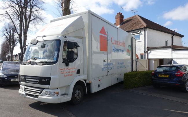 Bromsgrove Removals firm Campbell's lorry backed up to a residential property